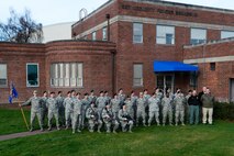 Members of the 627th Security Forces Squadron stand outside of their main squadron building, Feb. 24, 2015, at Joint Base Lewis-McChord, Wash. The squadron recently won the Air Mobility Command Outstanding Security Forces Small Unit of the Year award for 2014. (U.S. Air Force photo/Senior Airman Rebecca Blossom)