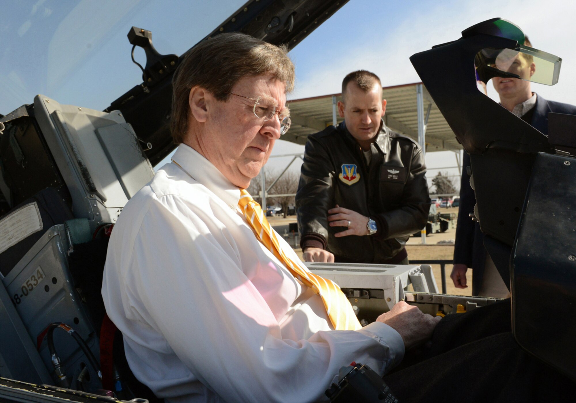 Maj. Chris Wells explains the F-16 Fighting Falcon cockpit controls to Tulsa Mayor Dewey F. Bartlett, Jr. during a visit February 25, 2015 at the Tulsa Air National Guard base, Tulsa, Okla. The mayor was hosted by 138th leadership as a community outreach event aimed at fostering good relations and educating local leaders on the mission of the wing.