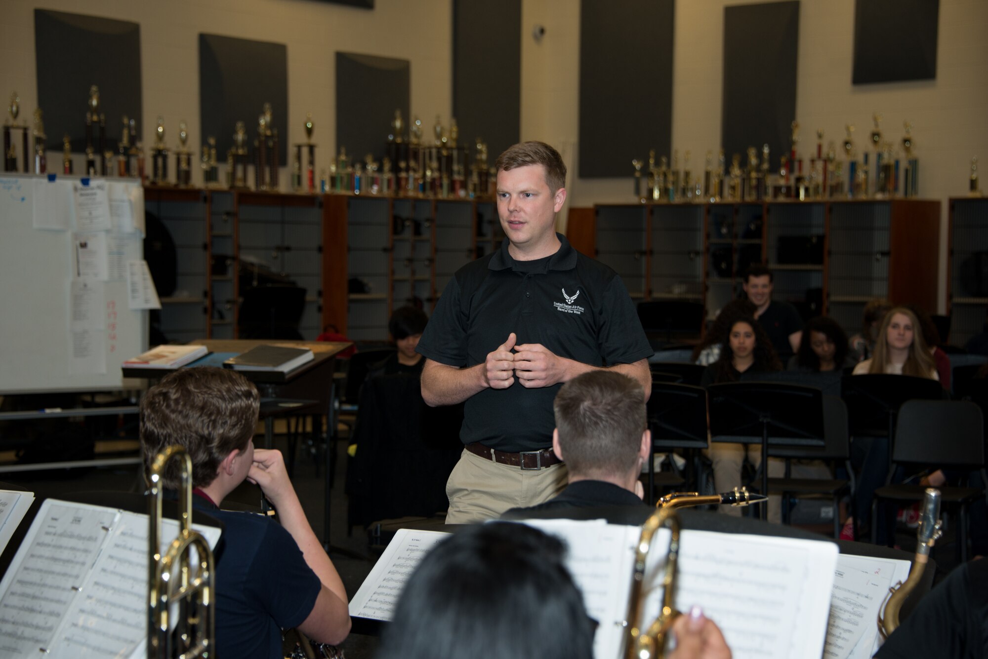 Senior Airman Jaime Parker, Air Force Band of the West ensemble trombonist, speaks with students during a music clinic at the Ocean Springs High School on Feb. 23, 2015 in Ocean Springs, Miss.  The Air Force Band of the West has been touring and performing in several cities along the Gulf Coast.  (U.S. Air Force photo by Marie Floyd)