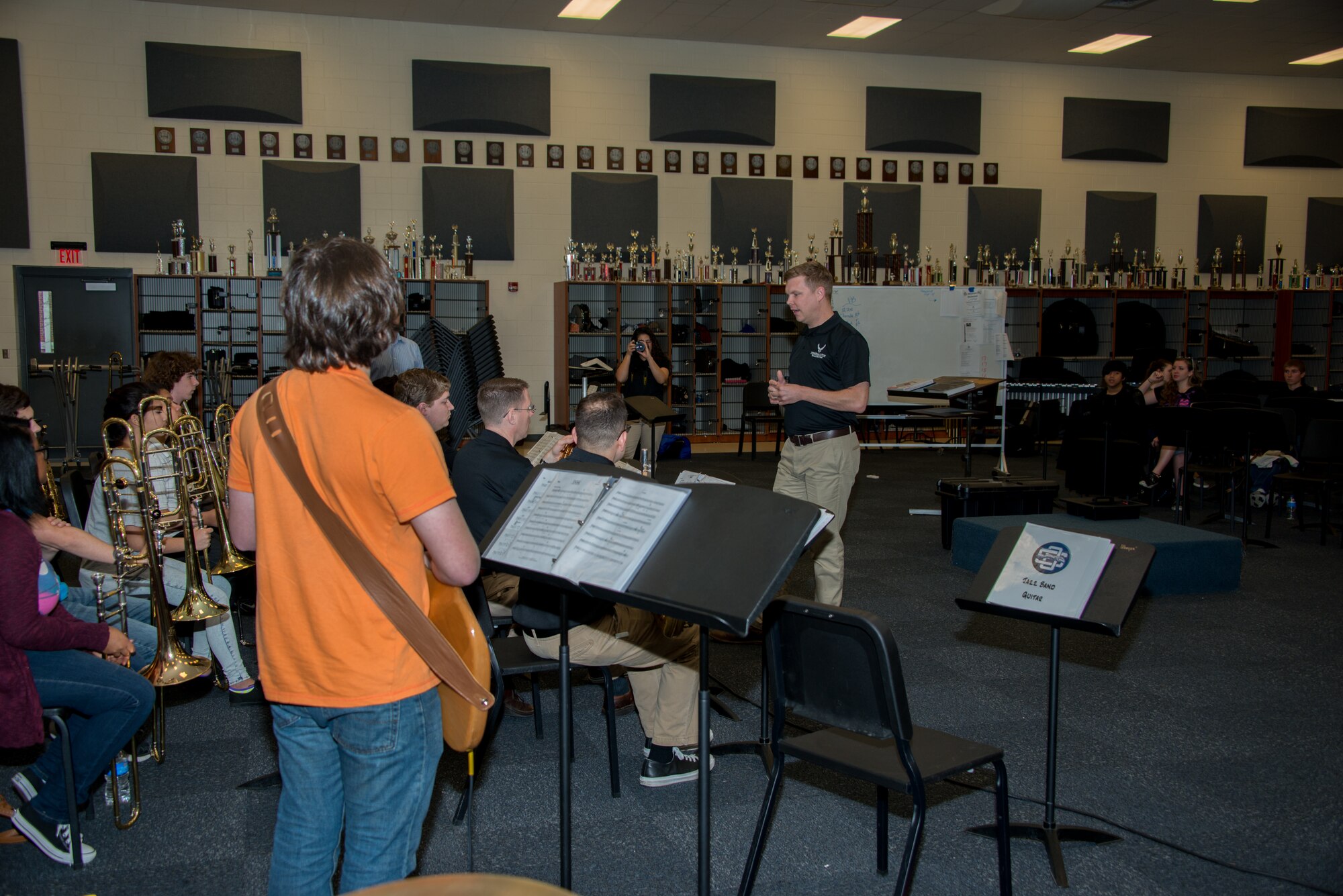 Senior Airman Jaime Parker, Air Force Band of the West ensemble trombonist, speaks with students during a music clinic at the Ocean Springs High School on Feb. 23, 2015 in Ocean Springs, Miss.  The Air Force Band of the West has been touring and performing in several cities along the Gulf Coast.  (U.S. Air Force photo by Marie Floyd)