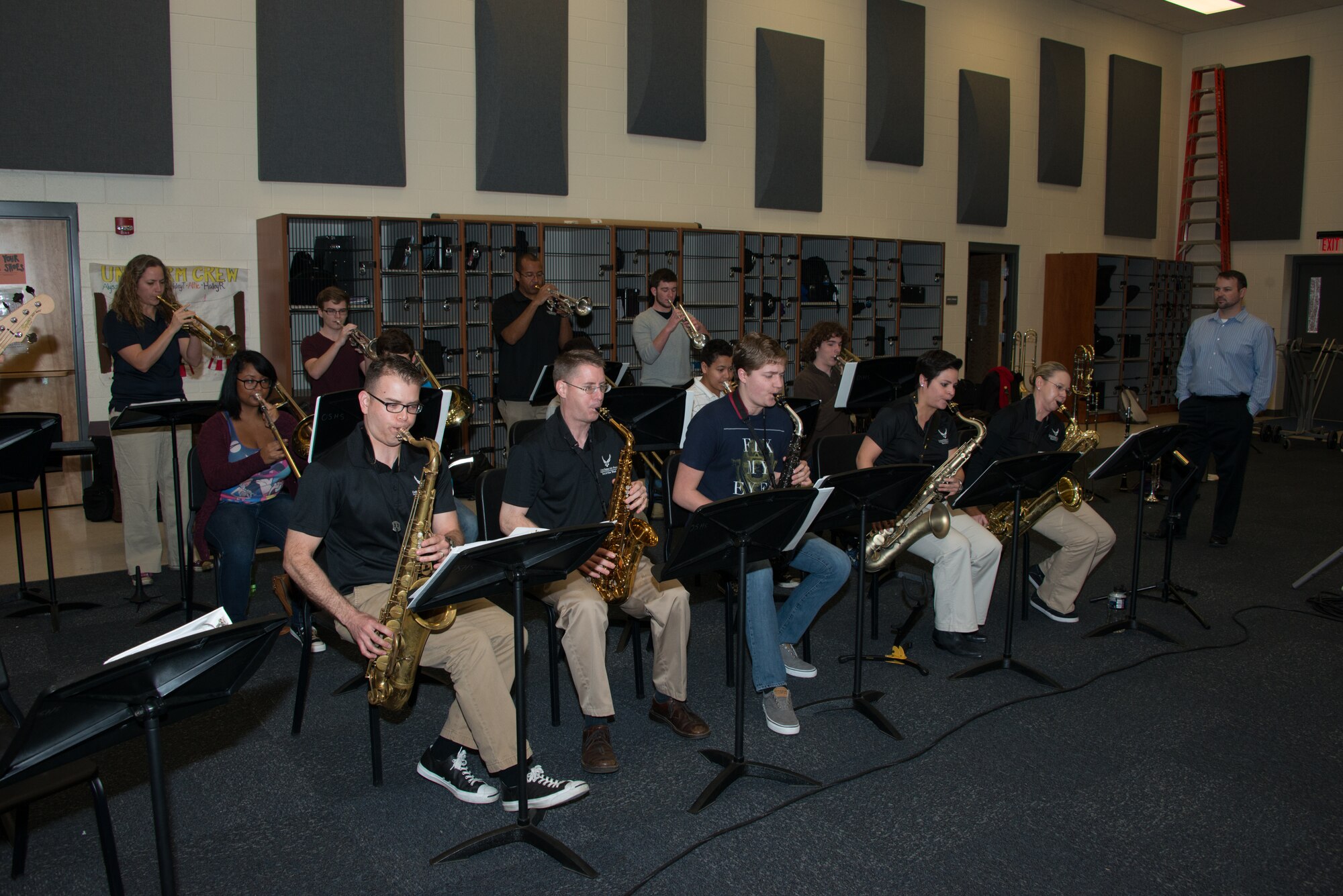 Members of the Air Force Band of the West ensemble, Dimensions in Blue, play alongside students of the Ocean Springs High School Jazz Band during a music clinic held at the school on Feb. 23, 2015 in Ocean Springs, Miss.  The Air Force Band of the West has been touring and performing in several cities along the Gulf Coast.  (U.S. Air Force photo by Marie Floyd)