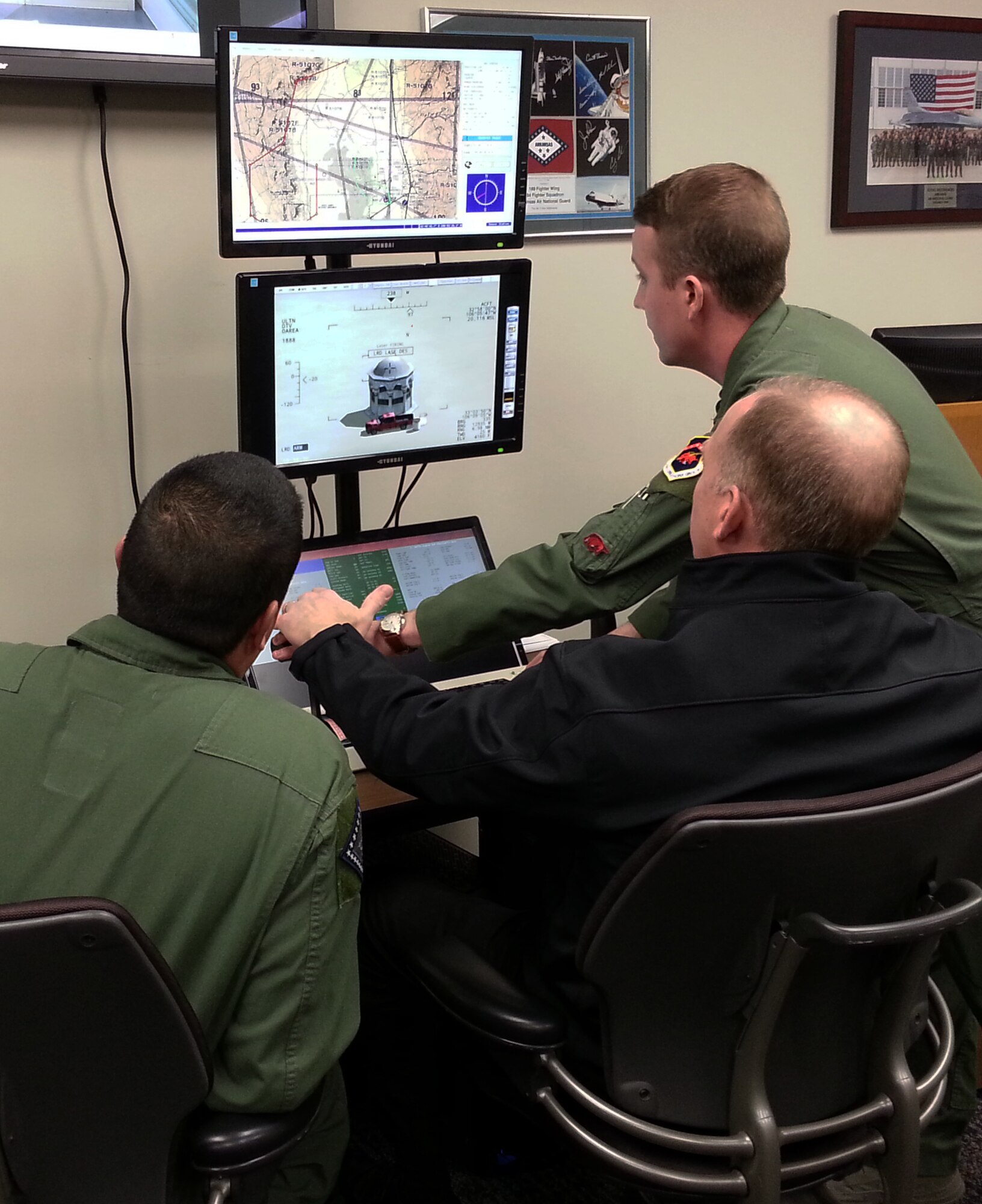 Brad Hegeman, President of Nabholz Construction Services, operates the 188th Wing’s Predator Reaper Integrated Mission Environment simulator alongside members of the 188th Operations Group Feb. 26, 2015. Hegeman is also the president of the Little Rock Air Force Base Community Council and a member of the Chief of Staff of the Air Force Civic Leader Program. The CSAF Civic Leader Program is an Air Staff-level program comprised of respected community leaders selected by officials from Air Force major commands, the National Guard Bureau and Headquarters Air Force. Hegeman toured the 188th Wing and received a mission and capabilities briefing during his visit. (U.S. Air National Guard photo by Maj. Heath Allen/released)