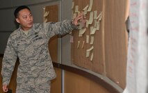 Tech Sgt. Young Suh, 22nd Contracting Squadron contract specialist, leads an Air Force Smart Operations of the 21st Century meeting Jan. 22, at McConnell Air Force Base, Kan. Agency representatives from around the base met to discuss ways to cut down the time it takes to reintegrate back into the base after a deployment. (U.S. Air Force photo by Senior Airman Colby L. Hardin)