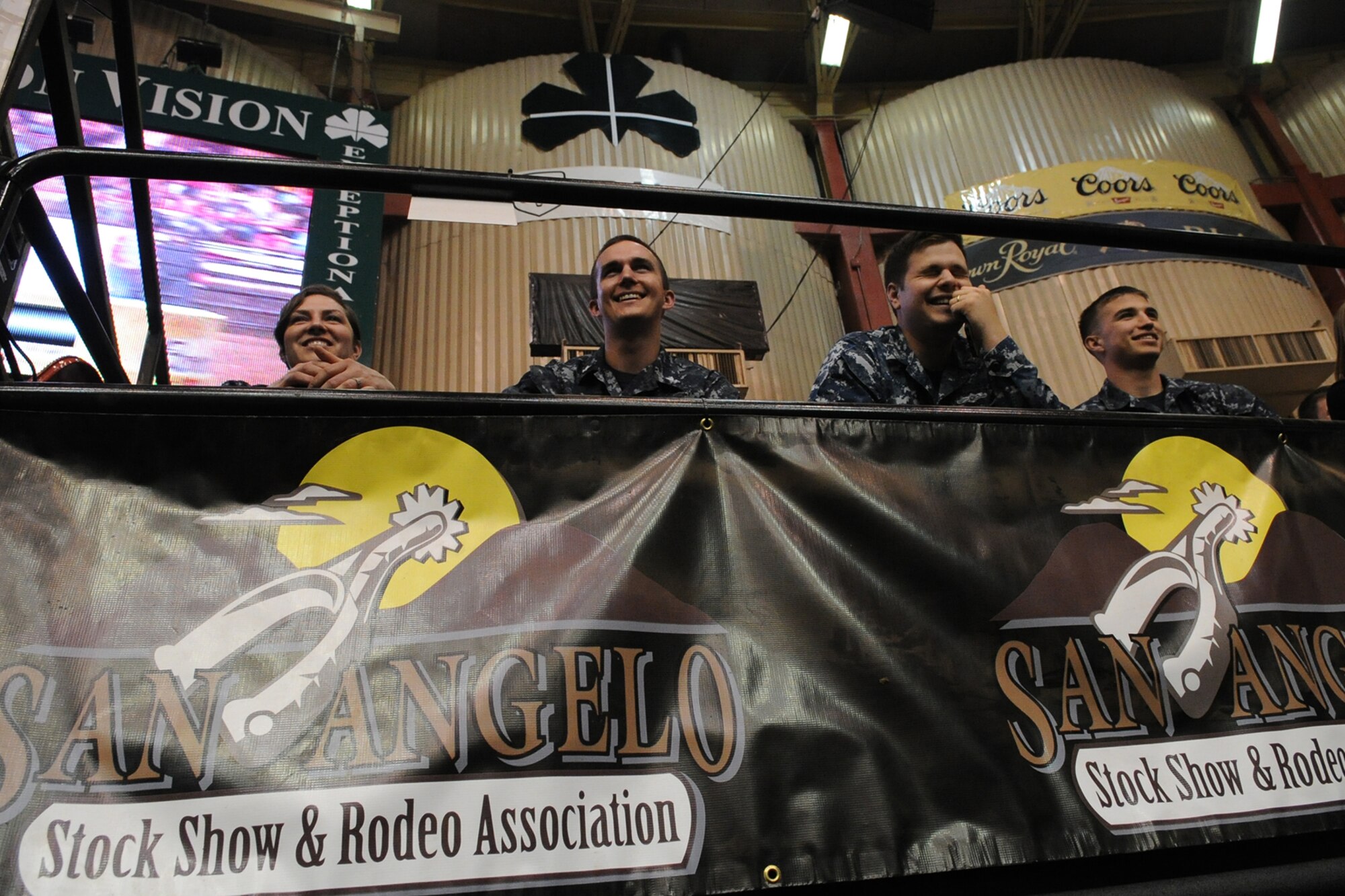 SAN ANGELO, Texas -- Navy Center for Information Dominance Detachment students watch barrel racing during the 83rd Annual San Angelo Stock Show and Rodeo Military Appreciation Night at the Foster Communications Coliseum Feb. 25. Exhibitions throughout the night included the San Angelo Ambassadors performing a drill routine and a music video at the end of the night thanking service members. (U.S. Air Force photo/ Staff Sgt. Laura R. McFarlane)
