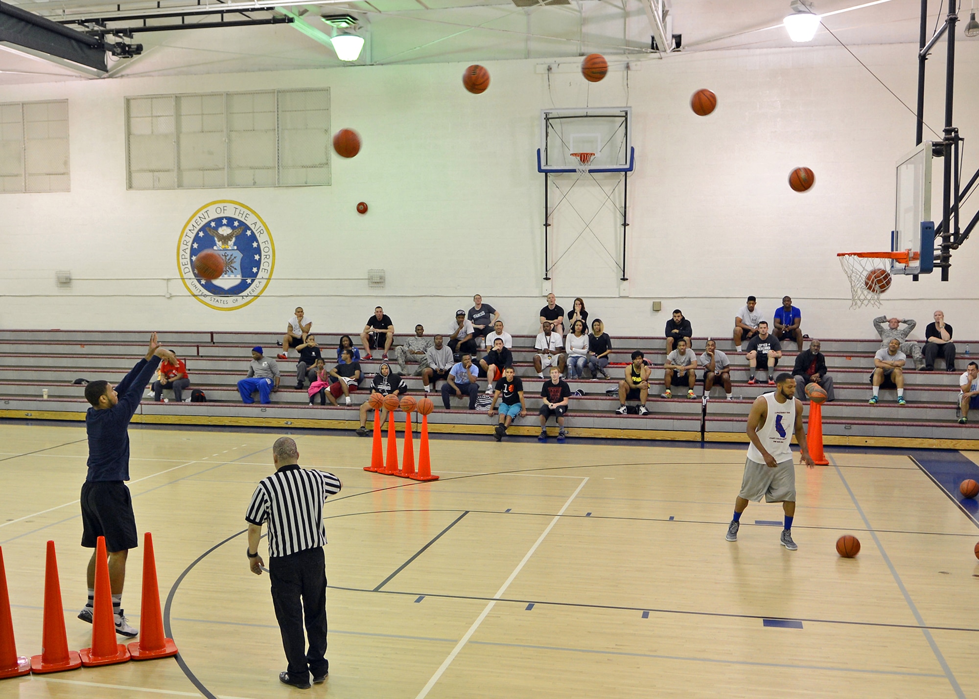 This photo composite shows Jadrien Wiser as he takes his shot during the three-point shootout held at the Rosburg Fitness Center Feb. 17. The shootout was part of a two-day All-Star Basketball Showcase which included players from multiple squadrons and units currently playing in the intramural basketball season. (U.S. Air Force composite photo by Jet Fabara)