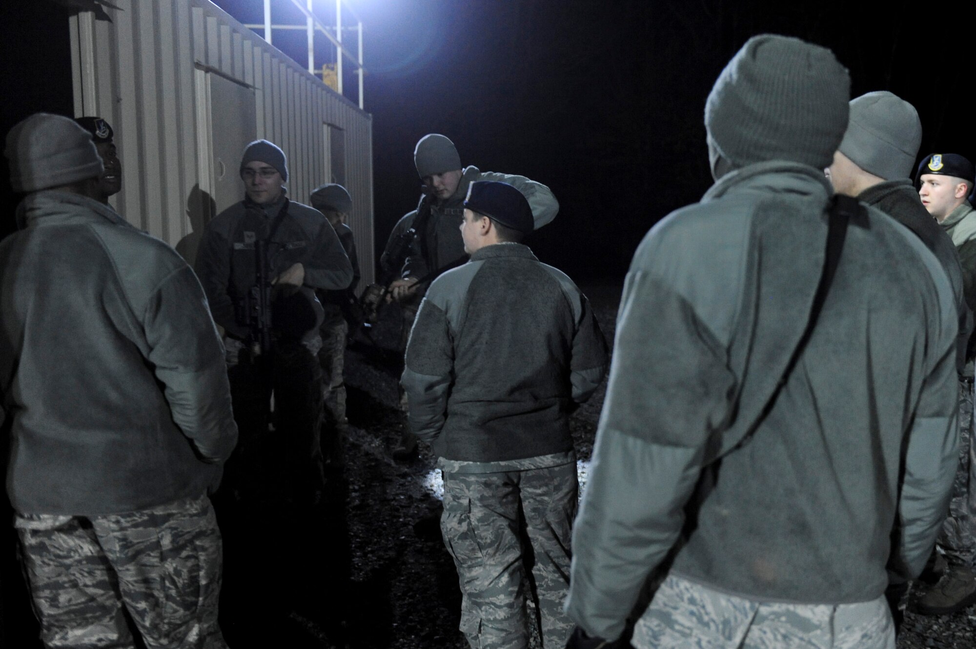 Airmen assigned to the 4th Security Forces Squadron receive instructions during monthly training Feb. 11, 2015, at the range training complex on Seymour Johnson Air Force Base, North Carolina. The facility currently houses three buildings, a shoot-move-communicate range and an ammunition issue point. (U.S. Air Force photo/Airman 1st Class Aaron J. Jenne)