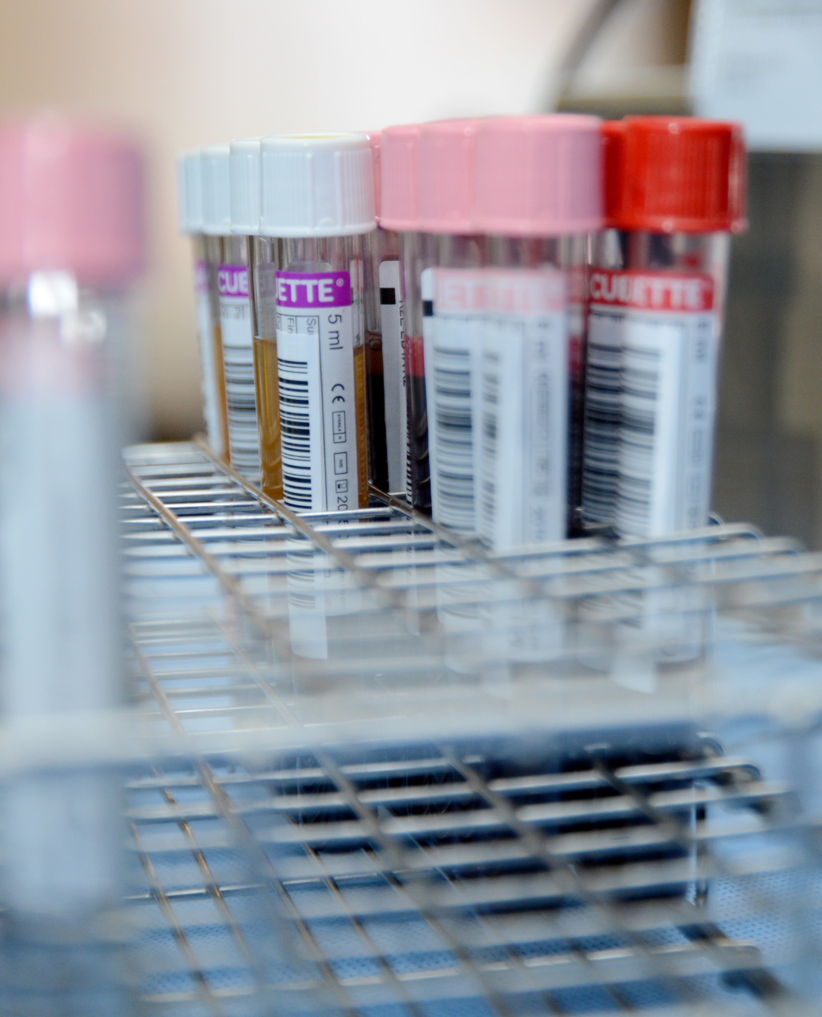 Vials of blood are set aside waiting to be packaged during a blood drive Feb. 25, 2015, on RAF Mildenhall, England. The blood was separated into plasma and red blood cells after being put into a machine which uses centrifugal force to spin it. Team Mildenhall members donated 82 units of blood in less than 10 hours. (U.S. Air Force photo by Karen Abeyasekere/Released)