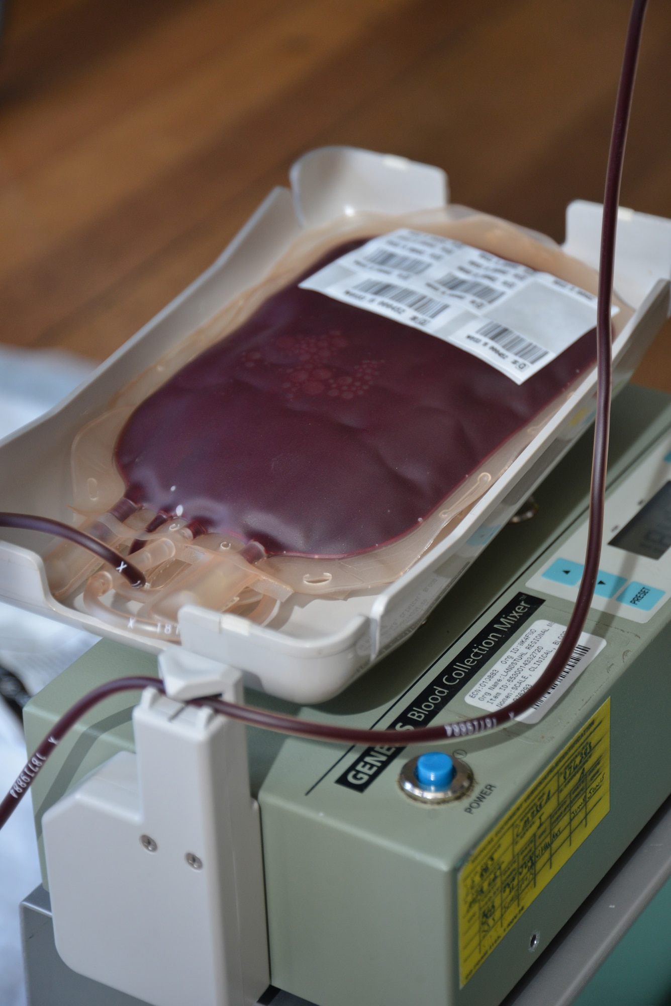 A one-pint bag of blood gradually fills up as Team Mildenhall Airmen donate during a blood donor session Feb. 25, 2015, on RAF Mildenhall, England. Laboratory technicians from the Armed Services Blood Program at Landstuhl Regional Medical Center, Germany, assisted by two lab technicians from RAF Lakenheath, visited RAF Mildenhall to collect voluntary blood donations from service members, family members, retirees and Department of Defense civilians. The blood collected is specifically given to other U.S. service members and veterans. (U.S. Air Force photo by Karen Abeyasekere/Released)