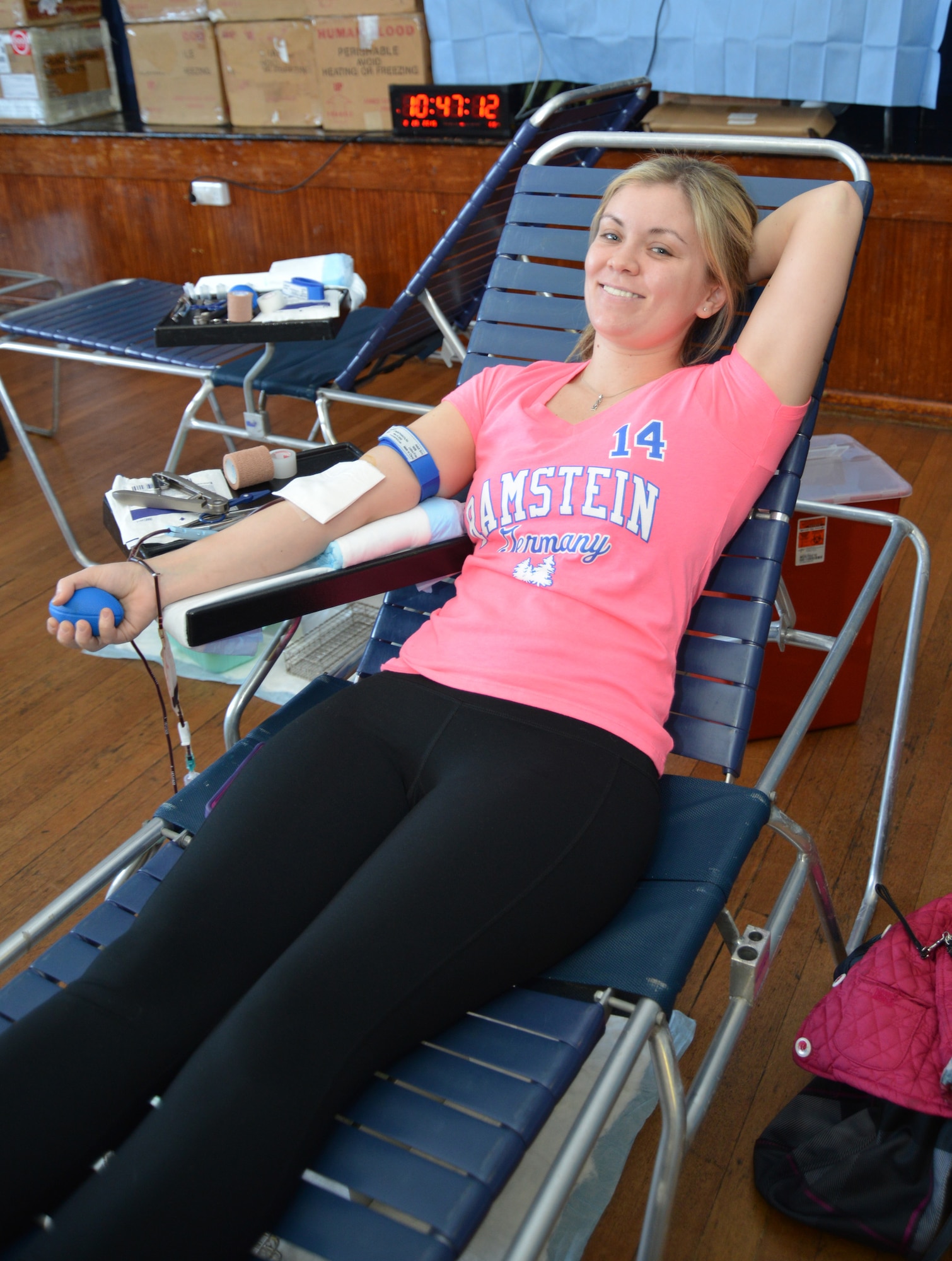 Kassandra Lubben, spouse of a Team Mildenhall member, from Centerville, Utah, relaxes as she donates blood Feb. 25, 2015, on RAF Mildenhall, England. Laboratory technicians from the Armed Services Blood Program at Landstuhl Regional Medical Center, Germany, visited RAF Mildenhall and RAF Lakenheath to collect one-pint blood donations from service members, family members, retirees and Department of Defense civilians. The blood collected is specifically given to other U.S. service members and veterans. (U.S. Air Force photo by Karen Abeyasekere/Released)