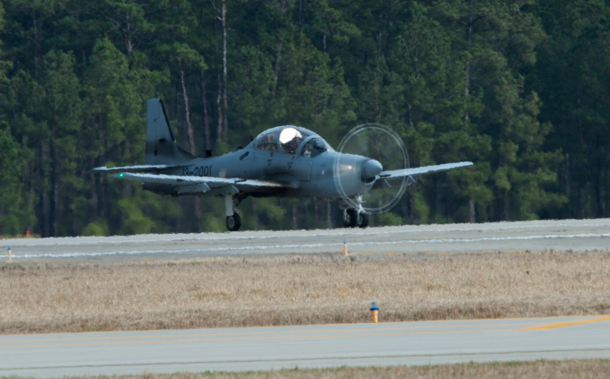 U.S. Air Force Maj. Jeffrey Lederhouse, 81st Fighter Squadron A-29 Super Tucano pilot, taxis an A-29 on the flightline Feb. 23, 2015, at Moody Air Force Base, Ga. Lederhouse flew with Brig. Gen. Michael Rothstein,  Train, Advise, Assist Command  Air (TAAC-AIR)commanding general, to demonstrate Moody’s Afghan air force training mission. (U.S. Air Force photo by Airman 1st Class Dillian Bamman/Released)