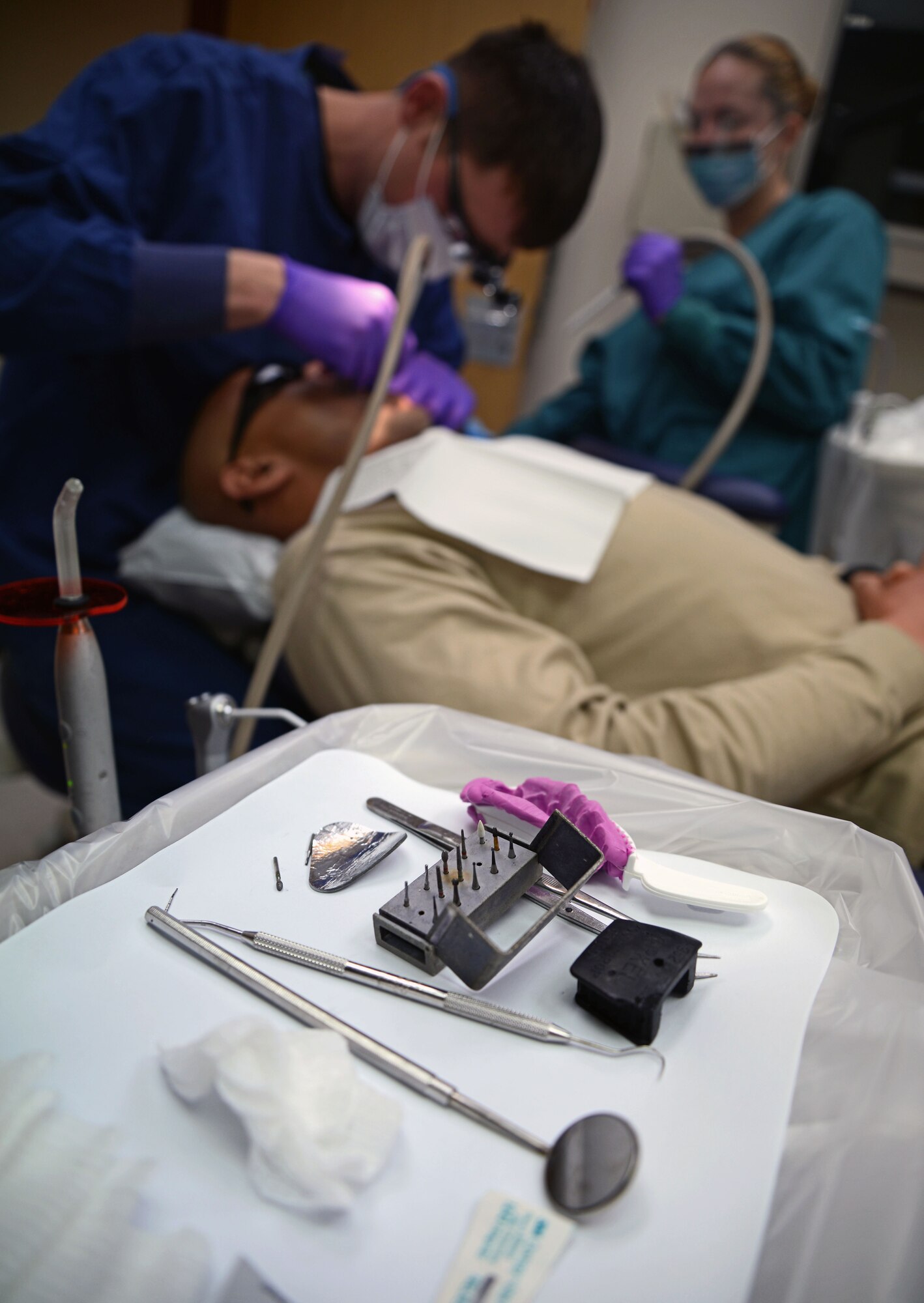 U.S. Air Force Maj. Douglas Grabowski, 48th Dental Squadron flight commander, and dentist from Chicago, preps a tooth for a final impression Feb. 20, 2015, on RAF Mildenhall, England. A dental impression is a reproduction of a patients tooth. (U.S. Air Force photo by Senior Airman Christine Griffiths/Released)