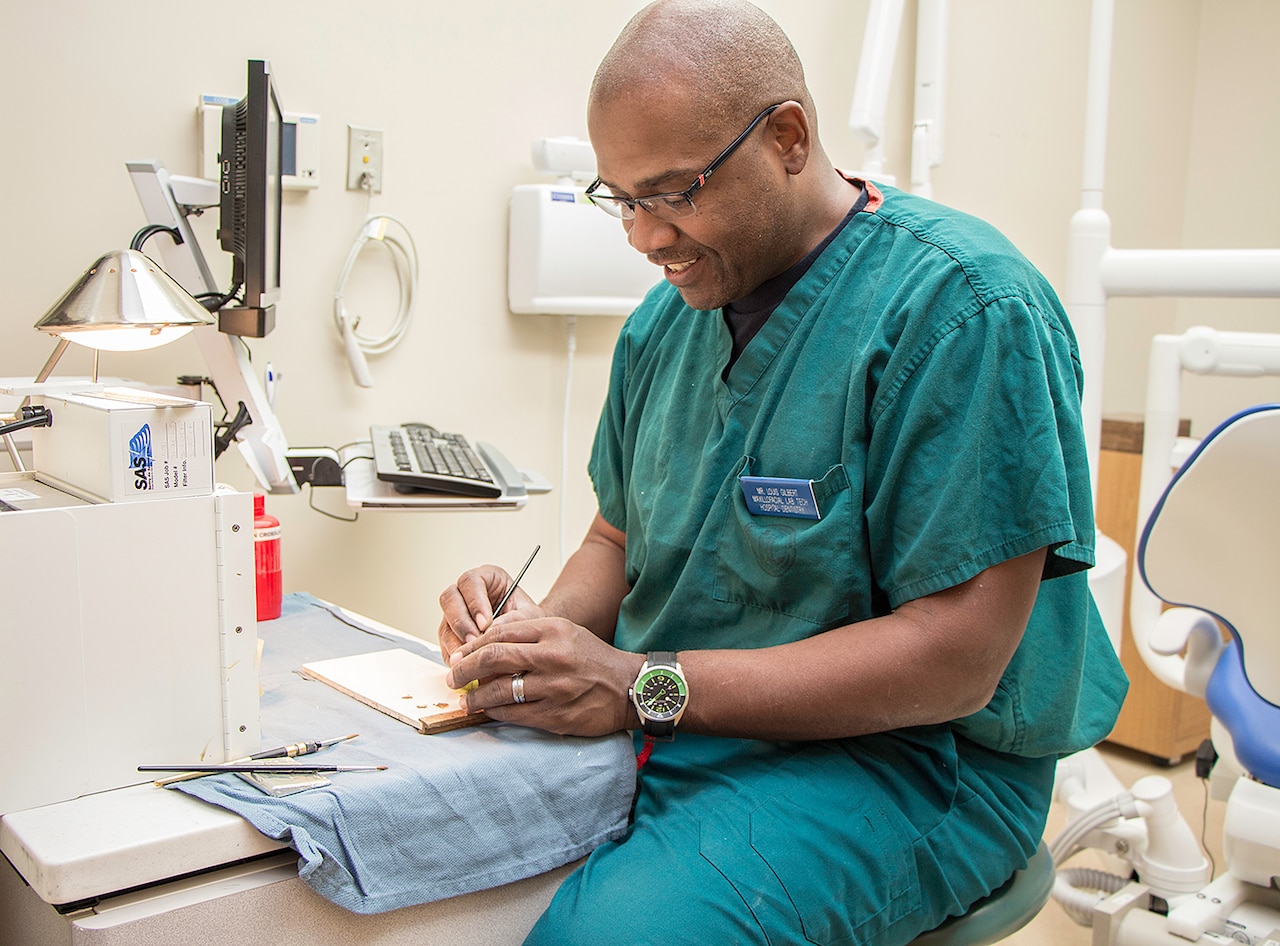 Navy retiree Louis Gilbert sketches out a design for a prosthetic eye at Walter Reed National Military Medical Center in Bethesda, Md. Courtesy photo