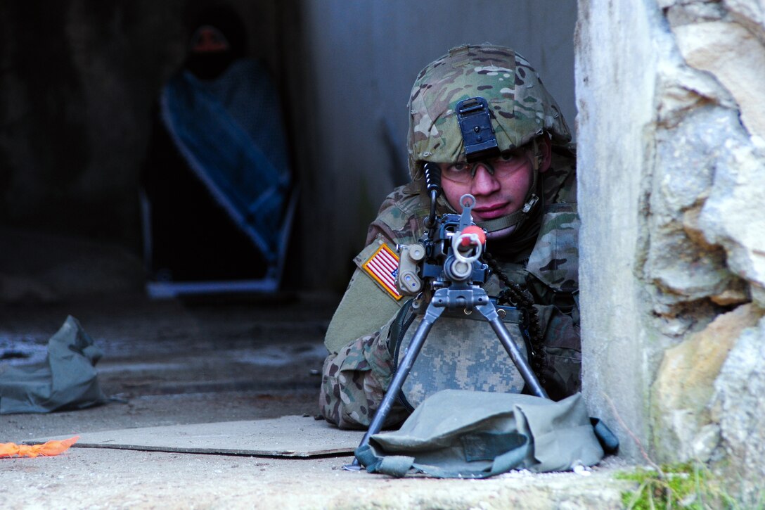A U.S. soldier keeps watch during a building clearing exercise as a part of Operation Atlantic Resolve on Drawsko Pomorskie training area, Poland, Feb. 25, 2015. 