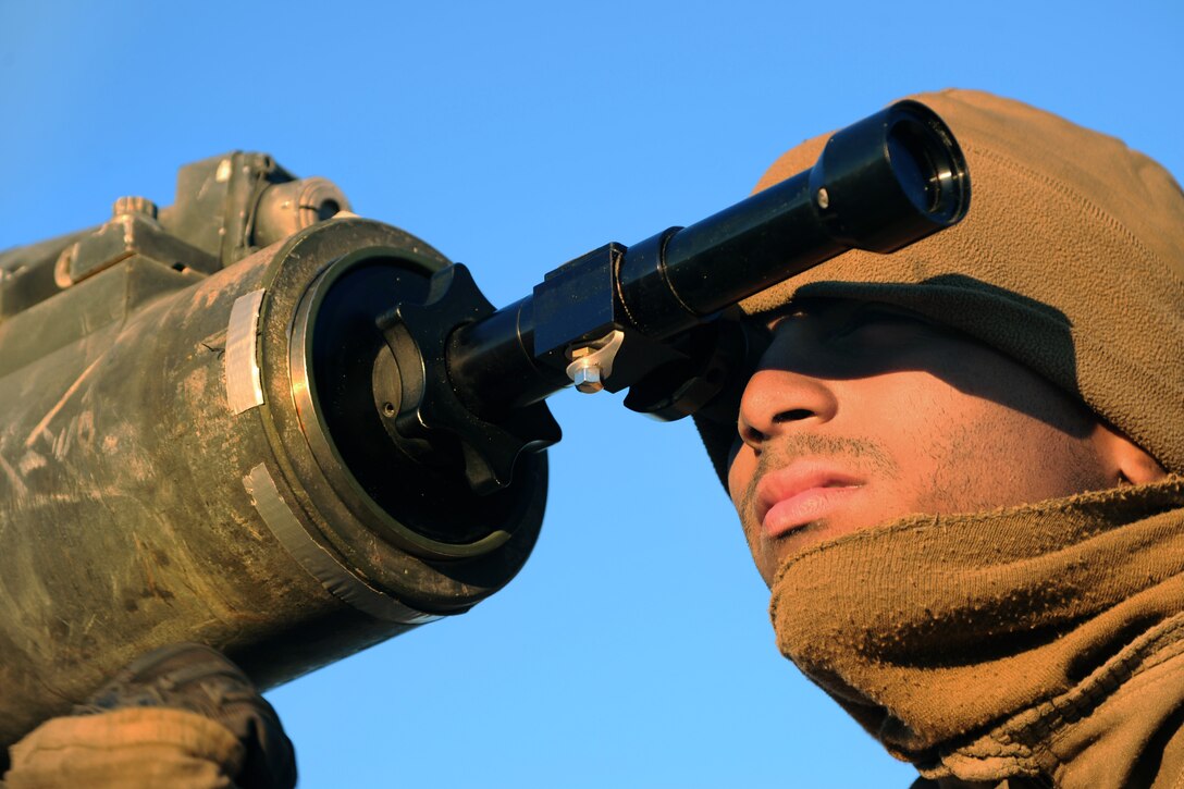 Marine Corps Lance Cpl. Steven Henriquez looks through a bore sight during Integrated Training Exercise 2-15 on Marine Corps Air Ground Combat Center Twentynine Palms, Calif., Feb. 12, 2015. Henriquez is assigned to Delta Company, 1st Tank Battalion.