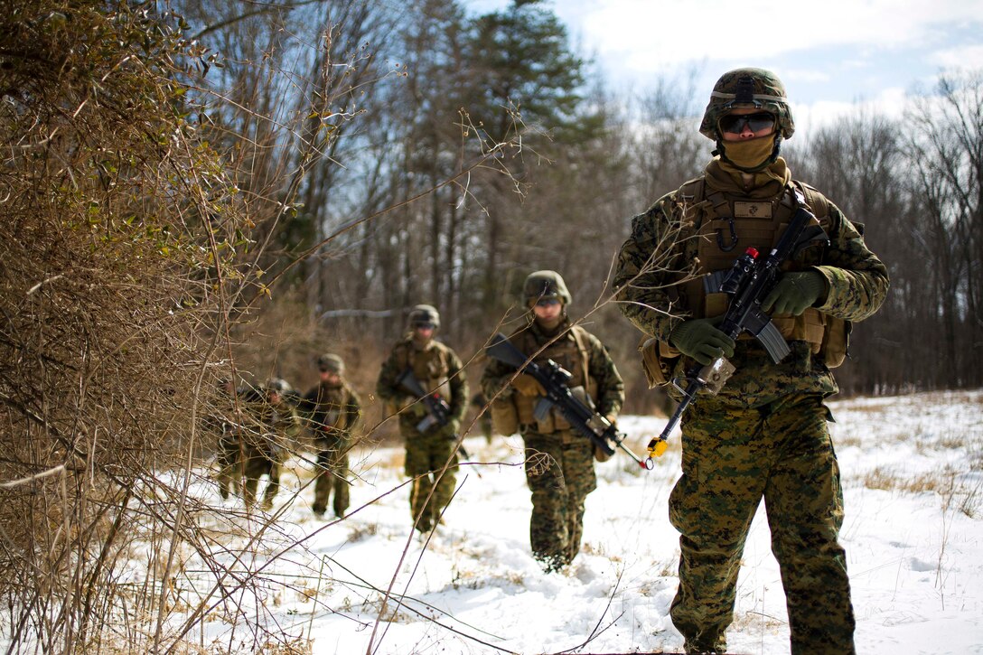Marine Corps Cpl. Tyler S. Gussin patrols during a deployment exercise on Marine Corps Base Quantico, Va., Feb. 18, 2015. Gussin is a machine gunner assigned to the 2nd Marine Division's Alpha Company, 1st Battalion, 8th Marine Regiment.