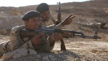 An Iraqi squad leader assigns a soldier his area of responsibility during defense training aboard Al Asad Air Base, Iraq, Feb. 8, 2015. The training gave the soldiers a greater understanding of basic ambush and defense maneuvers. 