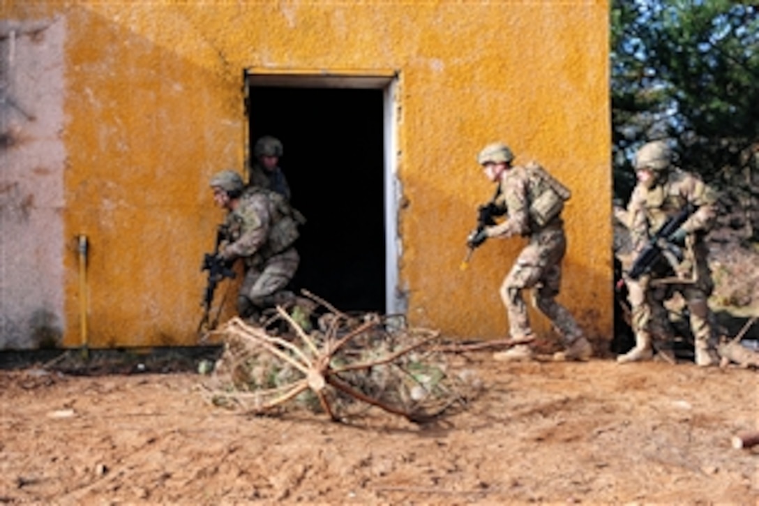 U.S. soldiers clear a building during a combined situational exercise with Polish land forces as part of Operation Atlantic Resolve at the Drawsko Pomorskie training area in Poland, Feb. 25, 2015. The soldiers are assigned to the 3rd Squadron,  2nd Cavalry Regiment.