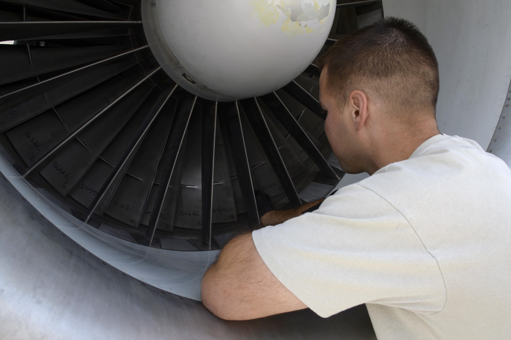 Staff Sgt. Derek, aerospace propulsion craftsman, performs an inlet and exhaust inspection on an E-3 Sentry airborne warning and control system aircraft at an undisclosed location in Southwest Asia Feb. 24, 2015. The inspection was done to check for any damage to the engine or anything that can potentially harm the engine like loose hardware or other forms of foreign objects. Derek is currently deployed from Tinker Air Force Base, Okla., and is a native of Waterboro, Maine. (U.S. Air Force photo/Tech. Sgt. Marie Brown)