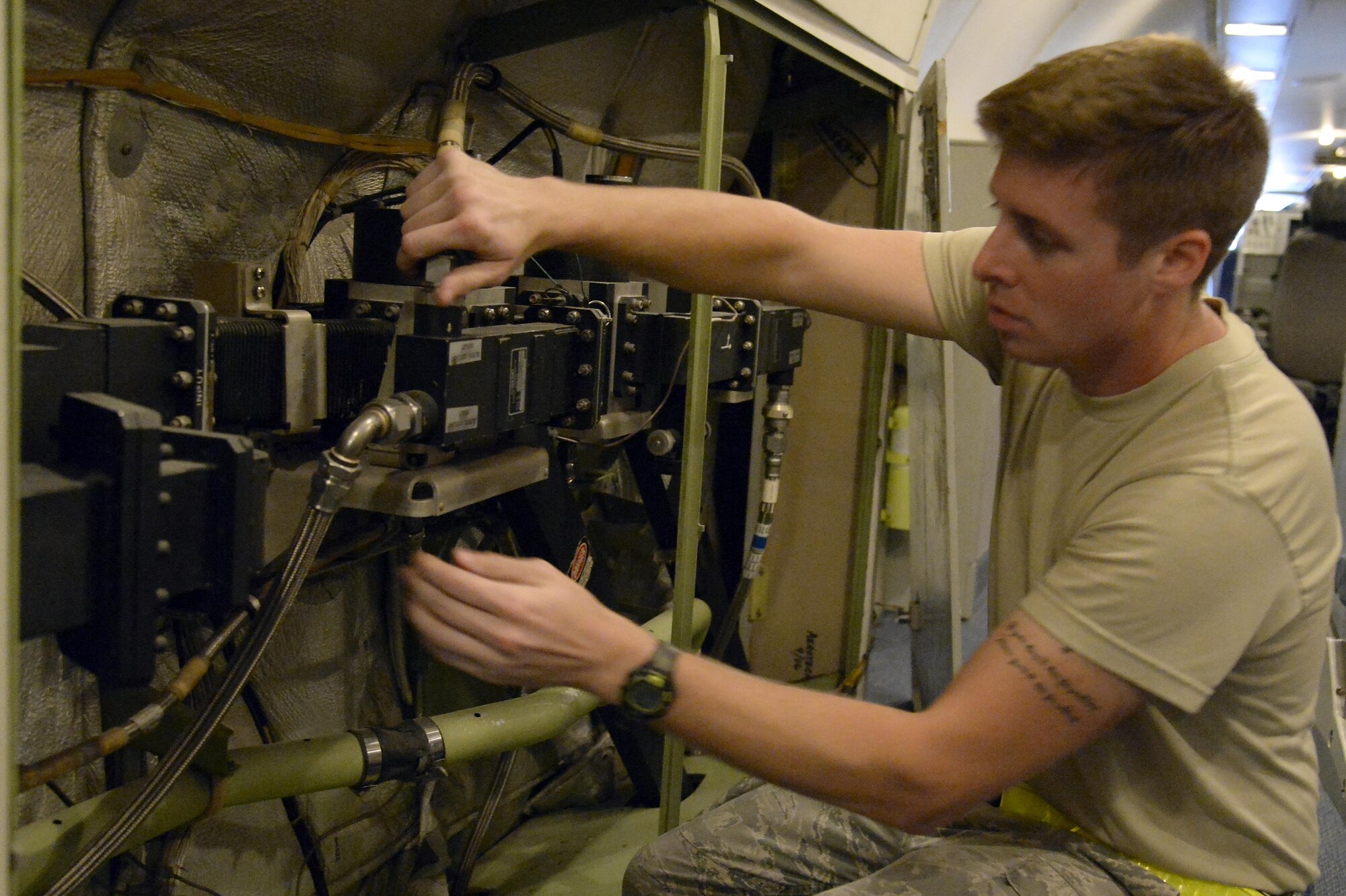 Senior Airman Travis, surveillance radar technician, inspects the wave guide for any signs of damage or leaking, and ensures the connectors are secure during a preflight inspection on an E-3 Sentry airborne warning and control system aircraft at an undisclosed location in Southwest Asia Feb. 24, 2015. Sentry Aircraft Maintenance Unit Airmen provide command and control battle management to the combatant commanders here in the area of responsibility. Travis is currently deployed from Tinker AFB, Okla., and is a native of Snohomish, Wash. (U.S. Air Force photo/Tech. Sgt. Marie Brown)