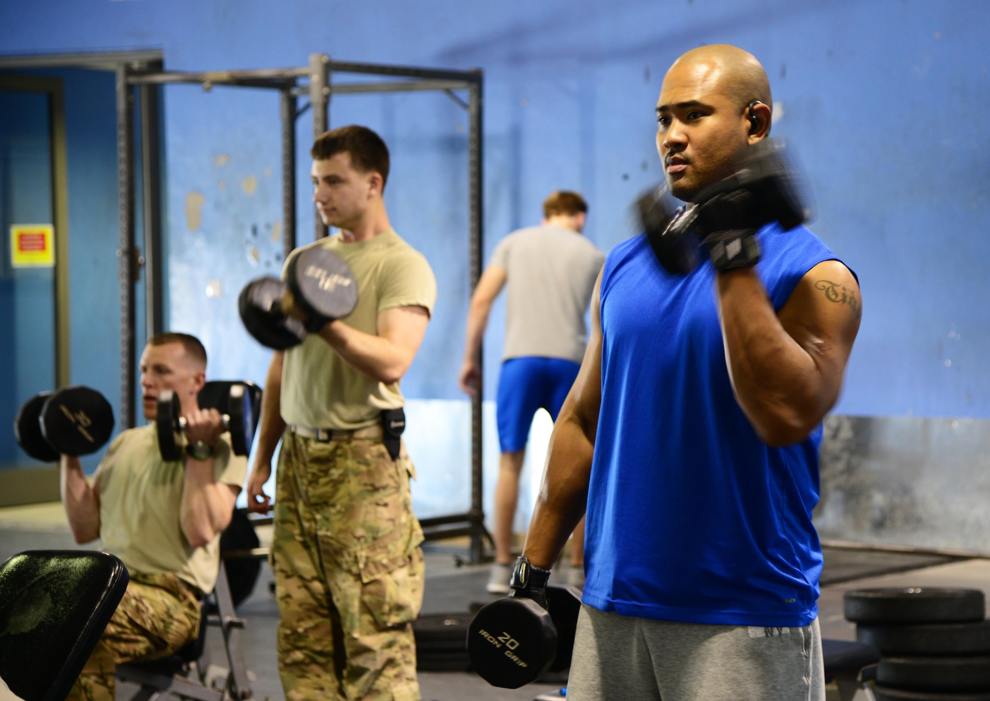 Servicemembers work-out at the Blatchford-Preston Complex Gym, Feb. 27, 2015, at Al Udeid Air Base, Qatar. Workout partners can help you stay committed to fitness while ensuring you are safely utilizing workout techniques. (U.S. Air Force photo by Staff Sgt. Mariko Frazee)