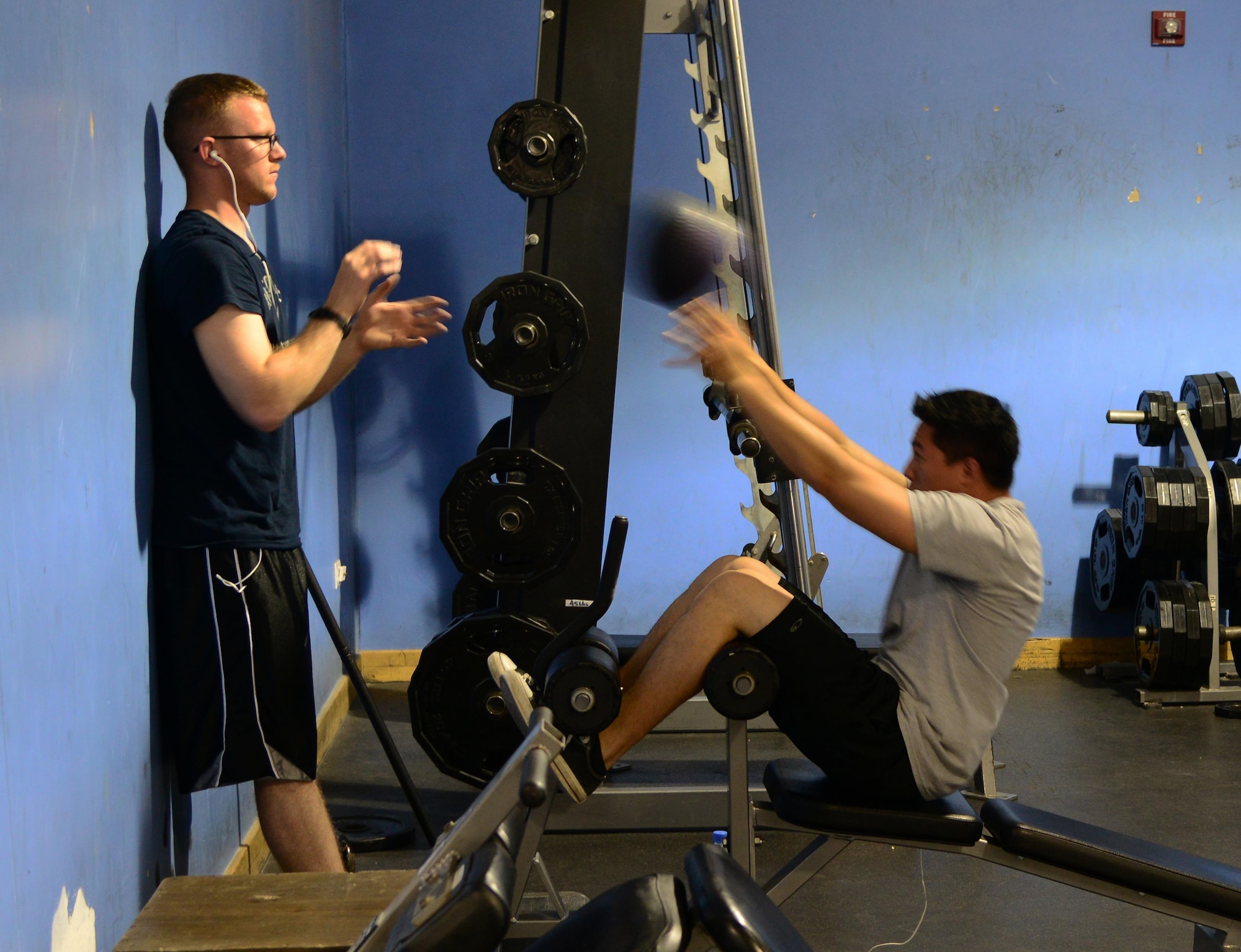 Servicemembers work-out at the Blatchford-Preston Complex Gym, Feb. 27, 2015, at Al Udeid Air Base, Qatar. Workout partners can help you stay committed to fitness while ensuring you are safely utilizing workout techniques. (U.S. Air Force photo by Staff Sgt. Mariko Frazee)