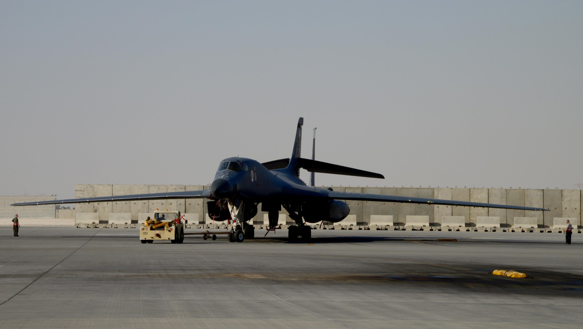 A B-1B Lancer assigned to the 34th Expeditionary Bomb Squadron, deployed from Ellsworth Air Force Base, S.D., is backed into a parking spot on the aircraft ramp, Feb. 25, 2015, at Al Udeid Air Base, Qatar. With an intercontinental range and the ability to carry up to 48,000 pounds of munitions at 900-plus mph, the B-1 can rapidly deliver massive quantities of precision and non-precision weapons against any adversary, anywhere in the world, at any time, making it a weapon system of choice against Da’ish targets in Iraq and Syria. (U.S. Air Force photo by Senior Airman Kia Atkins)