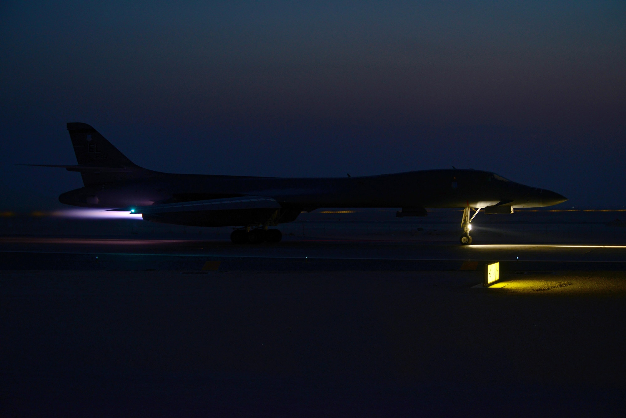 A B-1B Lancer assigned to the 34th Expeditionary Bomb Squadron, deployed from Ellsworth Air Force Base, S.D., takes off, Feb. 25, 2015, at Al Udeid Air Base, Qatar. B-1B Lancers can rapidly deliver massive quantities of precision and non-precision weapons against any adversary, anywhere in the world, at any time. Airstrikes provided by the B-1 have helped Iraqi and Kurdish forces to retake and hold key territory. (U.S. Air Force photo by Senior Airman Kia Atkins)