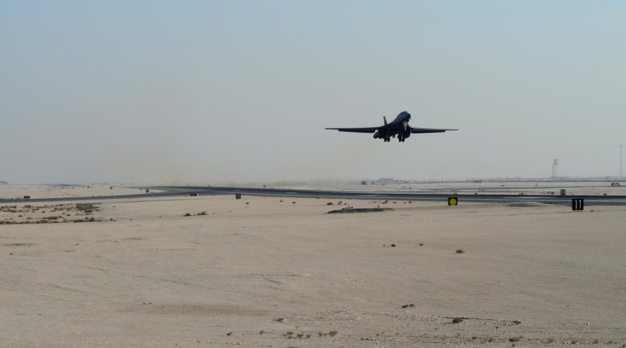 A B-1B Lancer assigned to the 34th Expeditionary Bomb Squadron, deployed from Ellsworth Air Force Base, S.D., takes off, Feb. 25, 2015, at Al Udeid Air Base, Qatar to support strike operations throughout the Central Command Area of Responsibility.  With an intercontinental range and the ability to carry up to 48,000 pounds of munitions at 900-plus mph, the B-1 can rapidly deliver massive quantities of precision and non-precision weapons against any adversary, anywhere in the world, at any time. (U.S. Air Force photo by Senior Airman Kia Atkins)