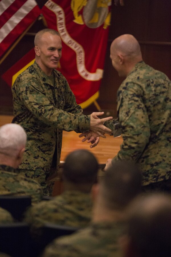 Sergeant Maj. Bradley Kasal, 4th Marine Division sergeant major, shakes hands of his fellow Marines and coworkers during a relief and appointment ceremony at Marine Corps Support Facility New Orleans, Feb. 26, 2015. The ceremony signified the end of his tour as the 4th MarDiv sergeant major. Marines bid farewell to Kasal as he prepares to assume his new post as the I Marine Expeditionary Force sergeant major and welcomed Sergeant Maj. Daniel Fliegel as the new sergeant major of 4th MarDiv.