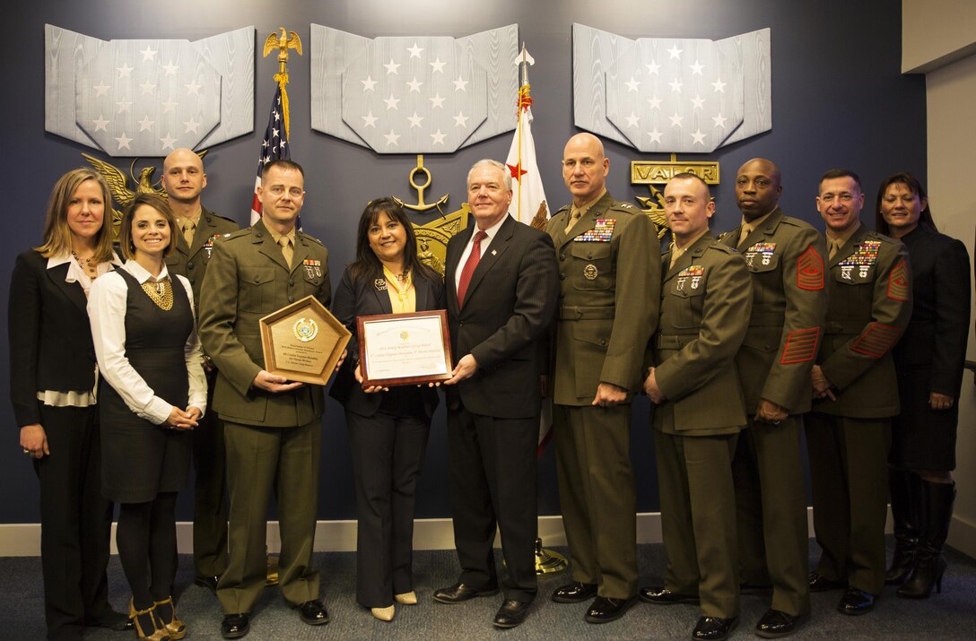 Marines from the 4th Combat Engineer Battalion receive the 2014 Department of Defense Reserve Family Readiness Award on Feb. 27, 2015, at the Pentagon Hall of Heroes.  The DoD RFRA program was established in 2000 to recognize the top unit in each Reserve component that demonstrated outstanding family readiness in support of superior mission readiness.