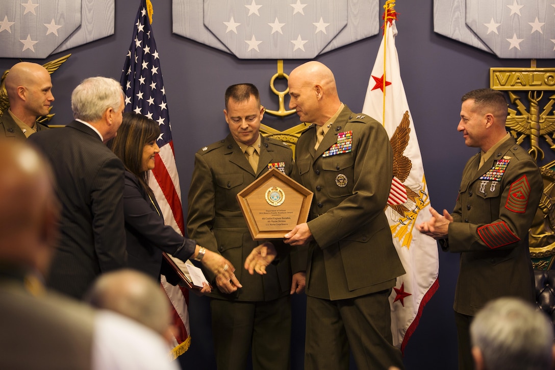 Marines from the 4th Combat Engineer Battalion receive the 2014 Department of Defense Reserve Family Readiness Award on Feb. 27, 2015, at the Pentagon Hall of Heroes.  The DoD RFRA program was established in 2000 to recognize the top unit in each Reserve component that demonstrated outstanding family readiness in support of superior mission readiness.