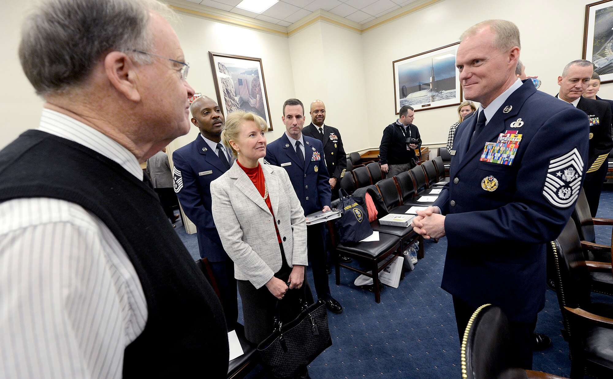 Chief Master Sgt. of the Air Force James A. Cody and his wife, Athena, meet with Rep. Samuel Sharon Farr, R-Ca., prior to the start of the House's Committee on Appropriations Subcommittee on Military Construction and Veterans Affairs Feb. 25, 2015, in Washington, D.C.  As part of his testimony, Cody spoke about the challenge of last year's force reductions and the impact of fiscal uncertainty on the force while facing global demands and geopolitical realities. In addition to Cody, the other witnesses were Sgt. Maj. of the Army Daniel A. Dailey, Master Chief Petty Office of the Navy Michael D. Stephens, and Sgt. Maj. of the Marine Corps Ronald Green. (U.S. Air Force photo/Scott M. Ash)