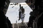 DEADHORSE, Alaska  (Feb. 26, 2015) - A paratrooper, with U.S. Army Alaska's 4th Infantry Brigade Combat Team (Airborne), 25th Infantry Division, leaps from the tailgate of a C-130 Hercules aircraft during Exercise Spartan Pegasus 
