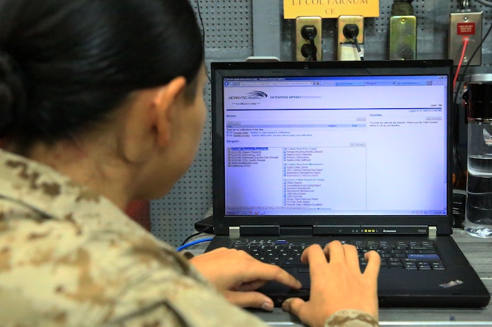 A Marine uses Global Combat Support System-Marine Corps to analyze task and transaction records. GCSS-MC is the primary technology provider for the Marine Corps Logistics Modernization strategy. John Wahl, lead contracting officer for GCSS-MC, led a team that reduced the price of two contracts by $2 million using Better Buying Power guidelines. (U.S. Marine Corps photo by Sgt. Jennifer Pirante)