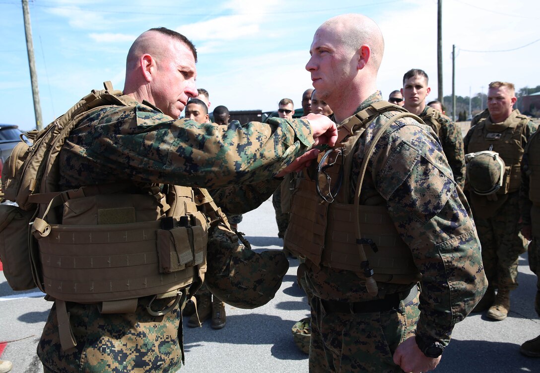 U.S. Marine Corps Sgt. Cody Fankboner, right, 22nd Marine Expeditionary Unit (MEU) headquarters commandant and native of Phoenix, is awarded the Navy and Marine Corps Commendation Medal by U.S. Marine Corps Col. William Dunn, left, 22nd MEU commanding officer at Marine Corps Base Camp Lejeune, N.C., Feb. 27, 2015.(U.S. Marine Corps photo by Cpl. Caleb McDonald/Released)