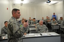 Capt. Donald Franklin, 26th Operations Support Squadron chief of wing tactics at Joint Base San Antonio-Lackland, explains the agenda during the first day of the Cyber Mission Commander Training at Joint Base Pearl Harbor-Hickam, Hawaii, Feb. 23, 2015. The Cyber Mission Commanders’ Training is a week-long tactical mission planning course that educates frontline operators on the proper way to plan and execute cyber space missions in support of command objectives. (U.S. Air Force photo by Master Sgt. Matthew McGovern/RELEASED)