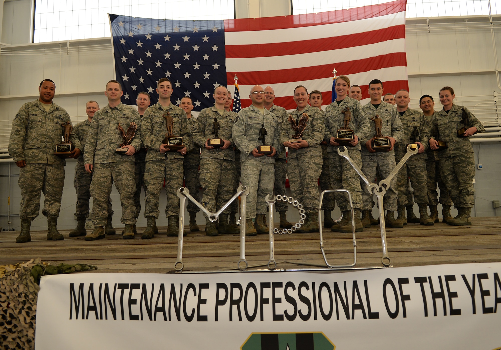 The 2014 Maintenance Professional of the Year award winners pose for photos after the banquet on Barksdale Air Force Base, La., Feb. 20, 2015. The banquet honors Airmen who excel in their career field and go above and beyond the call of duty. (U.S. Air Force photo/Senior Airman Benjamin Raughton)