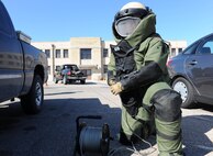 Staff Sgt. Brant Lundberg, 22nd Civil Engineer Squadron Explosive Ordinance Disposal team leader, pulls a cable attached to a simulated improvised explosive device, Feb. 25, at McConnell Air Force Base, Kan. EOD took part in an exercise that inspected the 22nd Air Refueling Wing’s response to a suspicious package during a base-wide operational readiness exercise. (U.S. Air Force photo by Airman 1st Class David Bernal Del Agua)