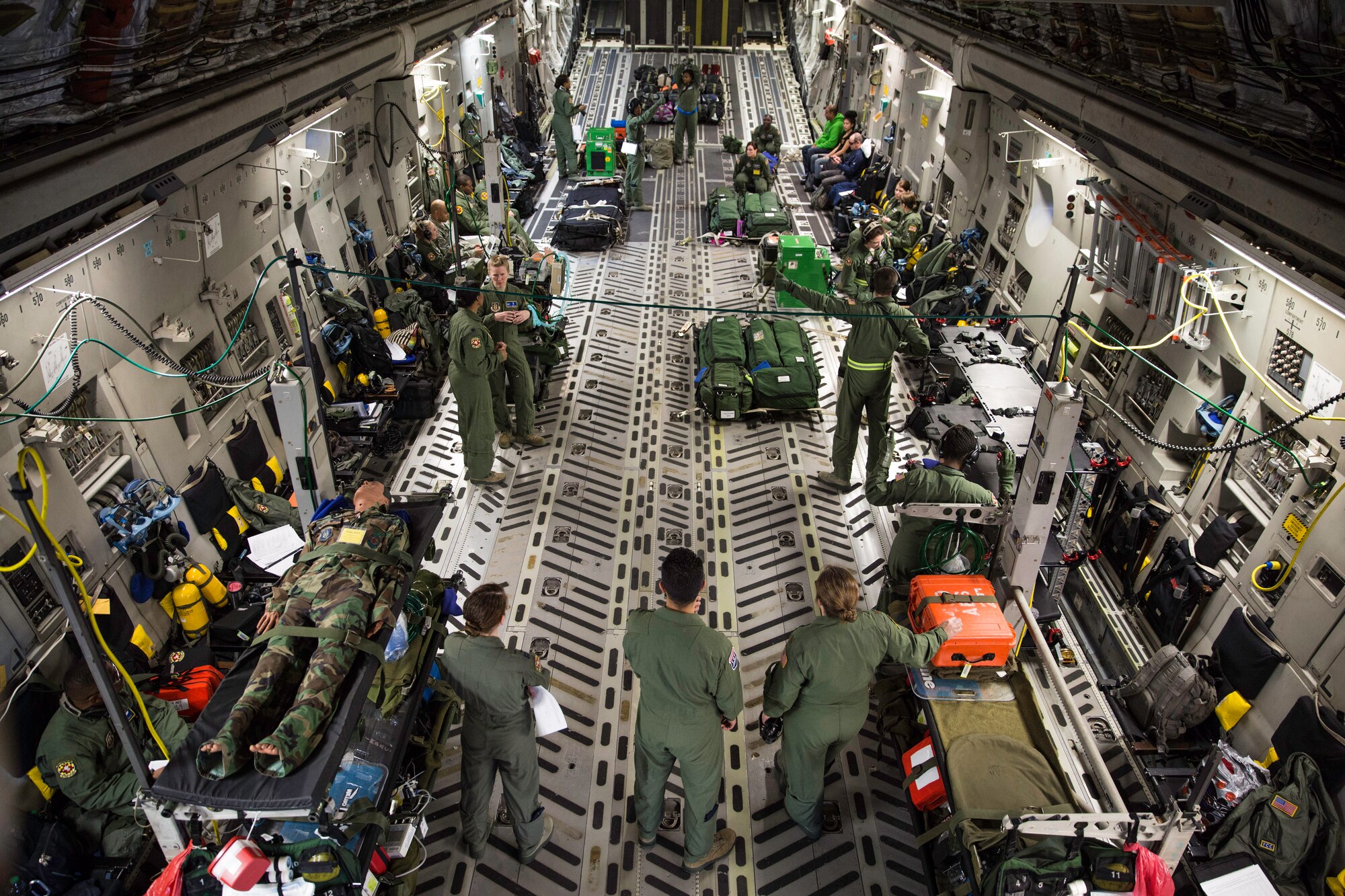 Reservists assigned to the 459th Air Refueling Wing at Joint Base Andrews, Md. conduct aeromedical training in a C-17 Globemaster III Feb. 22, 2015 during a training mission in San Juan, Puerto Rico. The mission was part of a three day fly-away with Airmen from the 315th Airlift Wing at Joint Base Charleston, S.C. and aeromedical Airmen from the 459th Air Refueling Wing at Joint Base Andrews, Md. The training mission was a cost-effective means to accomplish currency items and evaluations for flight crew members and provided C-17 familiarization and proficiency training for aeromedical Airmen. (U.S. Air Force Photo/Tech. Sgt. Shane Ellis)
