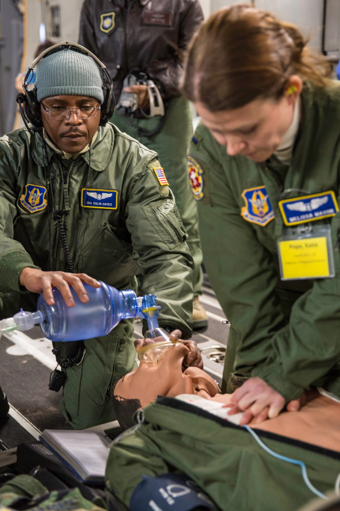 Senior Airman Colin Hayes and 1st Lt. Melissa Mason perform CPR on a mannequin Feb. 21, 2015 during a training mission in San Juan, Puerto Rico. The mission was part of a three day fly-away with Airmen from the 315th Airlift Wing at Joint Base Charleston, S.C. and aeromedical Airmen from the 459th Air Refueling Wing at Joint Base Andrews, Md. The training mission was a cost-effective means to accomplish currency items and evaluations for flight crew members and provided C-17 familiarization and proficiency training for aeromedical Airmen. Hayes is an aeromedical technician and Mason is a flight nurse. Both are assigned to the 459th Aeromedical Evacuation Squadron. (U.S. Air Force Photo/Tech. Sgt. Shane Ellis)
