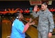 Staff Sgt. Jose Camacho congratulates a competitor after picking up a spare at the D.C. Special Olympics Bowling Championship Feb. 25, 2015, in Hyattsville, Md. Every year athletes from the across the National Capital Region compete in the four-day championship competition. Camacho works as a Paralegal/Civil Litigation for the Air Force Legal Operation Agency (AFLOA), Joint Base Andrews. (U.S. Air Force photo/James E. Lotz)