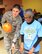 Staff Sgt. Jose Camacho helps a competitor line up her bowling ball at the D.C. Special Olympics Bowling Championship Feb. 25, 2015, in Hyattsville, Md. Every year athletes from the across the National Capital Region compete in the four-day championship competition. Camacho works as a Paralegal/Civil Litigation for the Air Force Legal Operation Agency (AFLOA), Joint Base Andrews. (U.S. Air Force photo/James E. Lotz)