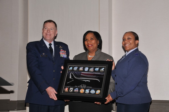 Keynote speaker Marcia M. Sturdivant, Ph. D, receives a gift from the 171st Air Refueling Wing Commander Col. Edward Metzgar and Technical Sgt. Shayla Pollard with recruiting as a thank you for her time and motival speech given at the 171st Air Refueling Wing's 32nd annual African-American Heritage Luncheon, Friday, Feb. 27, 2015, at the Pittsburgh Airport Marriott in Coraopolis, Pa. The event allowed the 171st ARW to celebrate "A Century of Black Life, History, and Culture" with the local community during African-American History Month. (U.S. Air National Guard photo by Airman 1st Class Allyson L Manners/ Released)