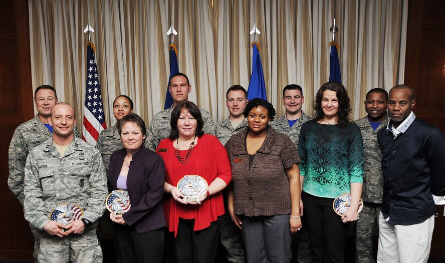 Air Force District of Washington Commander Maj. Gen. Darryl Burke and Command Chief Master Sgt. Farrell Thomas pose for a photo with the 2014 Headquarters AFDW Annual Award winners at Joint Base Andrews, Md. (U.S. Air Force photo/James E. Lotz) 