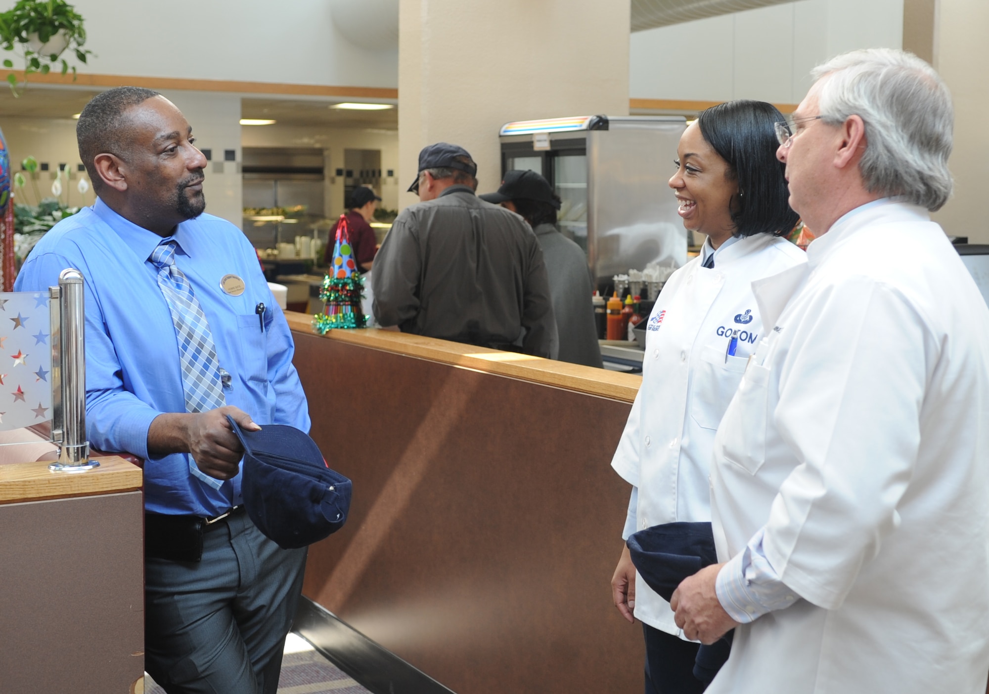 Evaluators Jim Wulforst and Senior Master Sgt. Melody Goitom speak with Mr. Honre Batie during the Hennessey Award Trophy Competition evaluation at Joint Base Andrews, Md., Feb. 20, 2015. (U.S. Air Force photo/Staff Sgt. Nichelle Anderson)