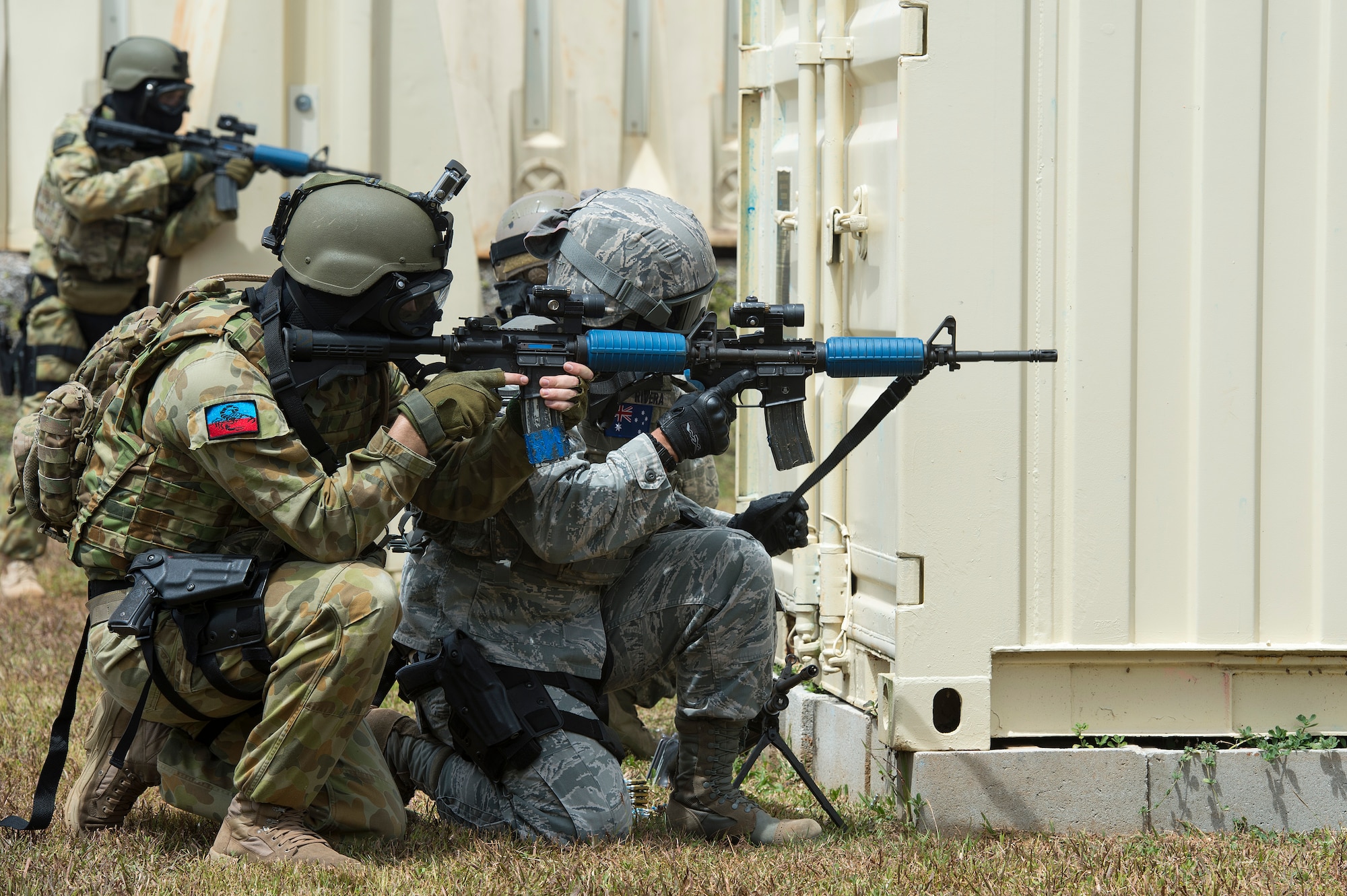 U.S. Air Force Airmen from the 736th Security Forces Squadron, and Royal Australian Air Force airfield defense guards, work as a team to eliminate an opposing force, while participating in a force on force combat scenario during Exercise Cope North 15, Feb. 23, 2015, at the Commando Warrior Pacific Regional Training Center, Andersen Air Force Base, Guam. Through training exercises such as Exercise Cope North 15, the U.S., Japan and Australia air forces develop combat capabilities, enhancing air superiority, electronic warfare, air interdiction, tactical airlift and aerial refueling. (U.S. Air Force photo by Tech. Sgt. Jason Robertson/Released)
