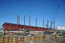 The steel beams are erected that will hold the roof of Hangar 1126 is being built, Feb. 24, at McConnell Air Force Base, Kan. The hangar is being built in preparation for the arrival of the KC-46A Pegasus. (U.S. Air Force photo by Airman 1st Class Christopher Thornbury)