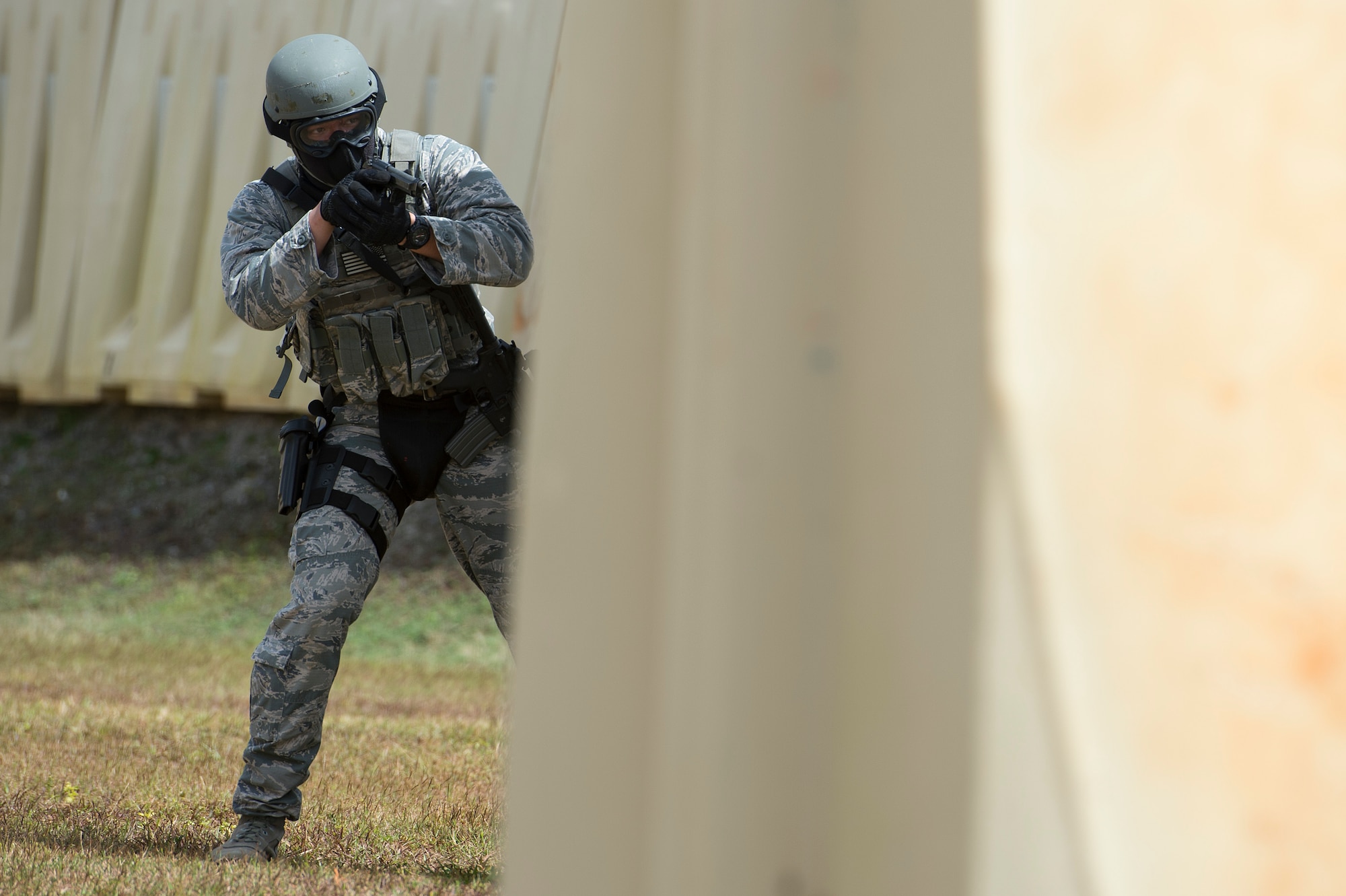 A U.S. Air Force Airman from the 736th Security Forces Squadron, scans his sector of fire while participating in a force on force combat scenario with Royal Australian Air Force airfield defense guards, at Exercise Cope North 15, Feb. 23, 2015, at the Commando Warrior Pacific Regional Training Center, Andersen Air Force Base, Guam. Through training exercises such as Exercise Cope North 15, the U.S., Japan and Australia air forces develop combat capabilities, enhancing air superiority, electronic warfare, air interdiction, tactical airlift and aerial refueling. (U.S. Air Force photo by Tech. Sgt. Jason Robertson/Released)