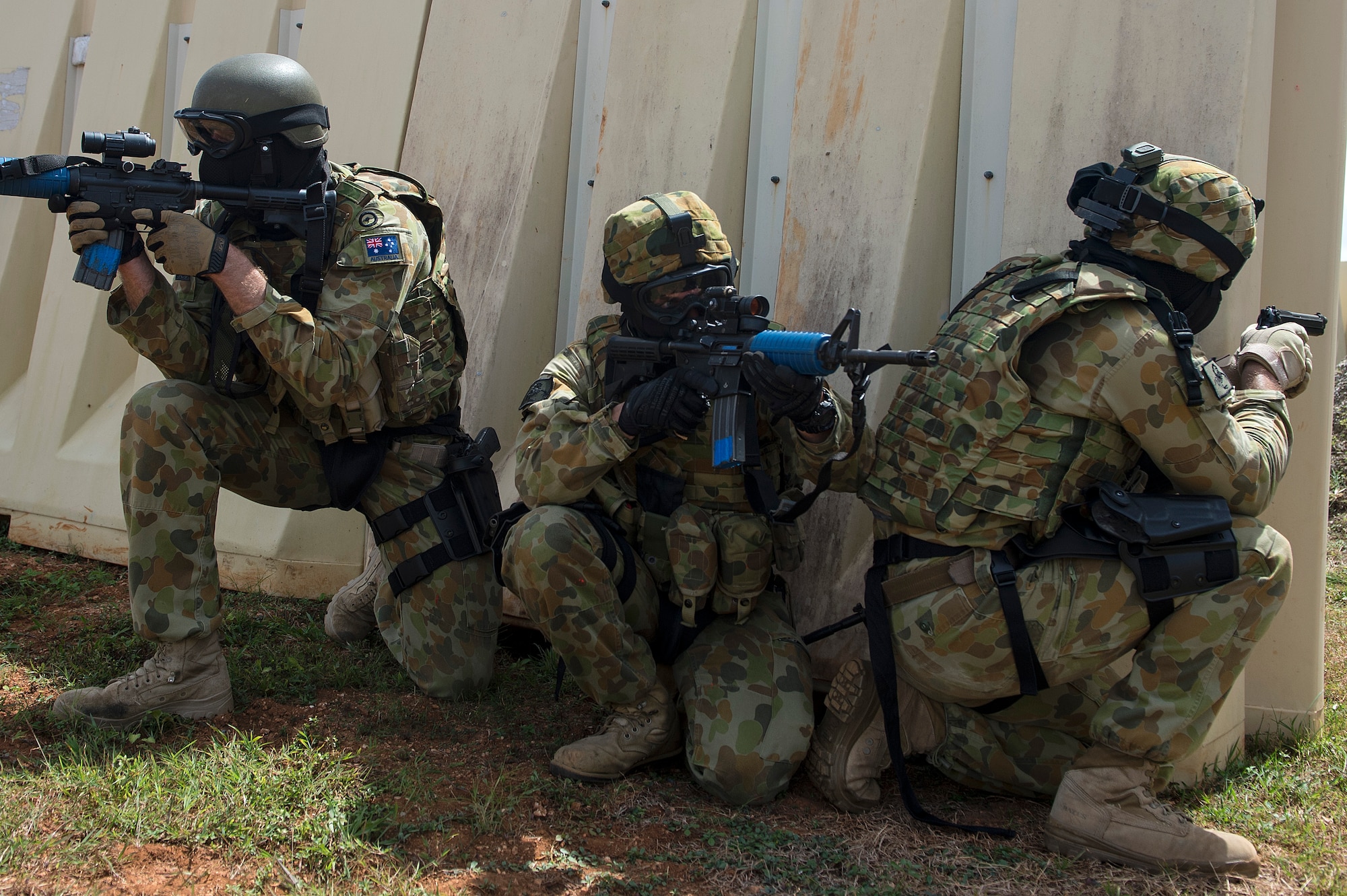 Royal Australian Air Force airfield defense guards, scans their sectors of fire while participating in a force on force combat scenario with U.S. Air Force Airmen from the 736th Security Forces Squadron, at Exercise Cope North 15, Feb. 23, 2015, at the Commando Warrior Pacific Regional Training Center, Andersen Air Force Base, Guam. Through training exercises such as Exercise Cope North 15, the U.S., Japan and Australia air forces develop combat capabilities, enhancing air superiority, electronic warfare, air interdiction, tactical airlift and aerial refueling. (U.S. Air Force photo by Tech. Sgt. Jason Robertson/Released)