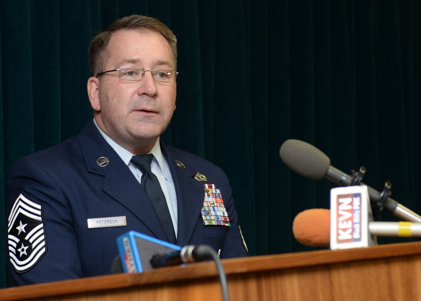 Chief Master Sgt. Kevin Peterson, 28th Bomb Wing command chief master sergeant, speaks with local media representatives about quality of life enhancement projects the base has completed during the state of the base address at Ellsworth Air Force Base, S.D., Feb. 26, 2015. Peterson explained how important these projects have been to enhancing the quality of life for young Airmen and how they contribute to a combat ready force. (U.S. Air Force photo by Senior Airman Anania Tekurio/Released)  